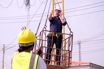 Engineer on the cable car working at the construction site.