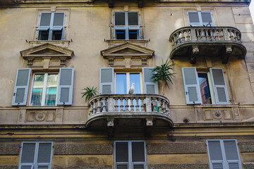 Facade of a medieval villa, Piazza in Italy with balconies and windows. Renaissance Era