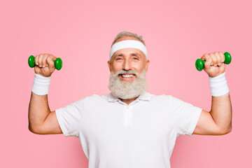 Cheerful emotional cool grey haired grandpa with humor grimace exercising holding equipment, lifts...