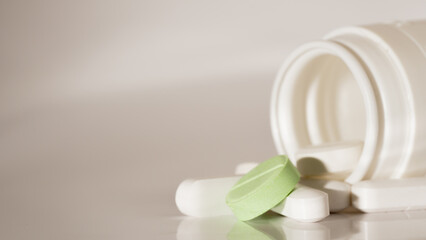 Fototapeta na wymiar macro photo of medicines scattered on white surface
