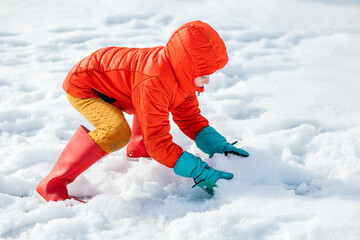 Boy playing with snow