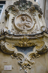 Religious relief on the wall of a historical building in Italy, Europe. Madonna and Child
