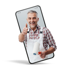 Confident painter and decorator  in a smartphone videocall and smiling, online  service concept