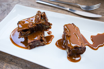 A brownie is a small chocolate cake, typical of the gastronomy of the United States. It is named for its dark brown color, or brown in English.