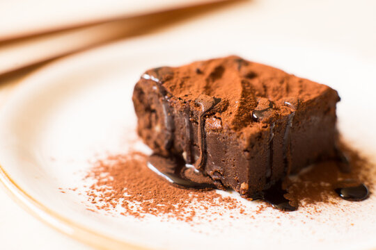 A Brownie Is A Small Chocolate Cake, Typical Of The Gastronomy Of The United States. It Is Named For Its Dark Brown Color, Or Brown In English.