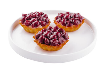 Small tarts with cherries on plate