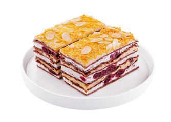 two slices of multilayer cocoa sponge cake with almonds