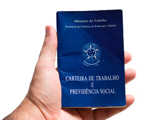 Hand holding Brazilian work card. labor portfolio and social security © Gustavo