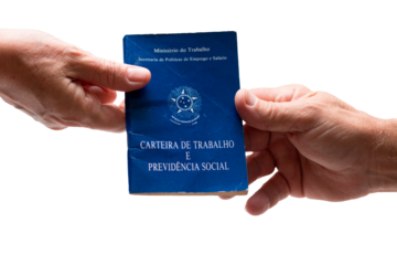 Hand holding Brazilian work card. labor portfolio and social security