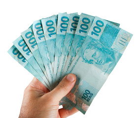 Brazilian money. Hand holding one hundred reais banknotes - 569220603