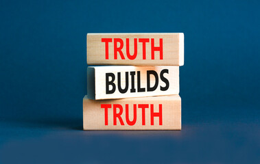 Truth builds trust symbol. Concept words Truth builds trust on wooden blocks on a beautiful grey table grey background. Business truth builds trust concept. Copy space.