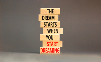 Start dreaming symbol. Concept words The dream starts when you start dreaming on wooden blocks....