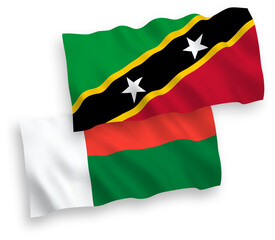 Flags of Federation of Saint Christopher and Nevis and Madagascar on a white background