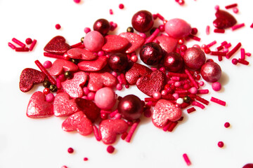 Many small white and red hearts on a white isolated background. The concept of love and romance. Romantic background composition. Valentine's Day