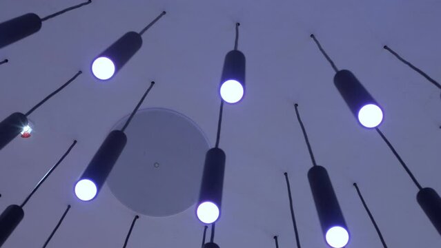 Ceiling in the mall with lighting. Ceiling lights custom designed for shopping center
