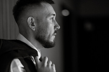portrait of smiling groom with beard