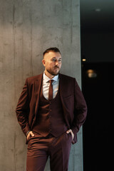 portrait of smiling groom with beard