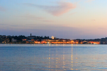 The old town of Rovinj with the church of St. Euphemia seen from the sea on a sunny day with blue sky