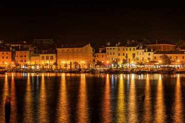 Sparkling lights in the evening in the port of Rovinj in Croatia