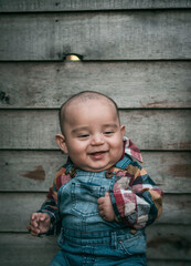 Fototapeta premium Beautiful portrait of a 4 month old baby laughing