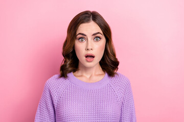 Fototapeta premium Photo of excited speechless cute woman with wavy hairstyle dressed knit sweater staring open mouth isolated on pink color background