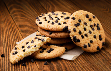 Chocolate chip cookies close-up on a wooden background.