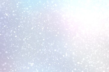Light falling snow on pearlescent airy background. Abstract texture. Winter sky.