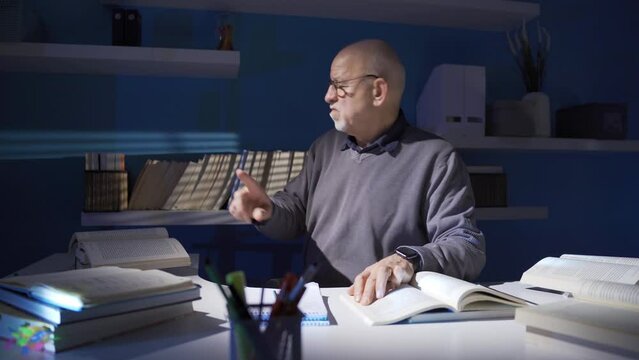 Researcher, historian, mature old man doing historical research.
A historian who reads, translates and writes scientific books.
