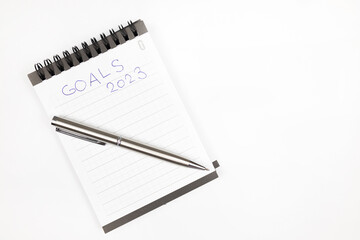 Goals 2023 plan notes with metal pen - Productivity plan - Business and self improvement