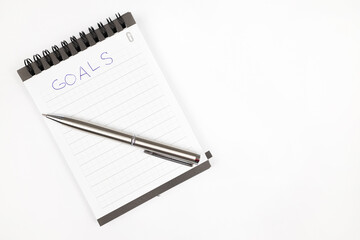 Goals 2023 plan notes with metal pen - Productivity plan - Business and self improvement