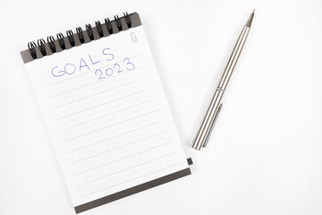 Goals 2023 plan notes with metal pen - Productivity plan - Business and self improvement