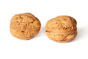 Walnuts in shell on white isolated background with shadow. Full depth of field