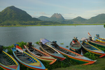 Fishing boats anchored at the Jatiluhur reservoir. Beautiful view of Jatiluhur reservoir with...