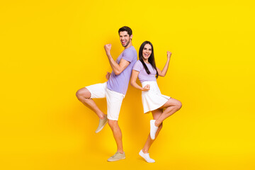 Fototapeta na wymiar Full body photo of pretty young girl male celebrate lottery luck excited dressed stylish violet clothes isolated on yellow color background