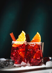 Negroni mezcalito alcoholic cocktail with mezcal, vermouth, bitters, herbal liqueur, orange,...
