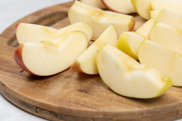 Sliced apple served on the wooden board