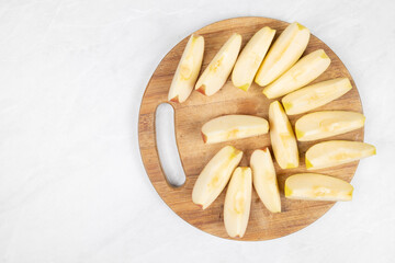 Sliced apple served on the wooden board