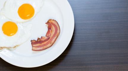 smiling fried eggs with bacon
