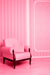 Vintage armchair in the interior, toned in pink