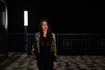 Night portrait of a long-haired girl