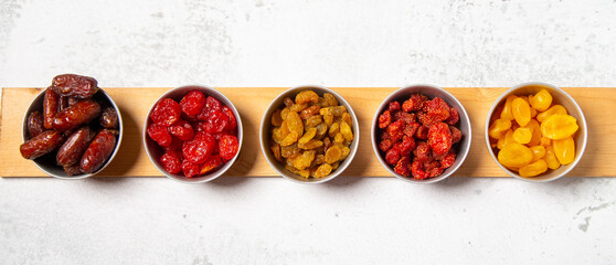 Concept: Ramadan food Sweets mixed of dried fruits , Dates premium dates, 
full of date fruits, Arabic coffee, Concept: month fasting culture Muslim prayer, 
1444 Puasa Ramadan Kareem greeting festiva