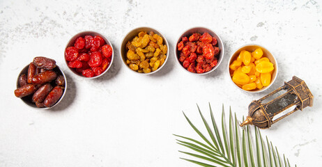 Concept: Ramadan food Sweets mixed of dried fruits , Dates premium dates, 
full of date fruits, Arabic coffee, Concept: month fasting culture Muslim prayer, 
1444 Puasa Ramadan Kareem greeting festiva
