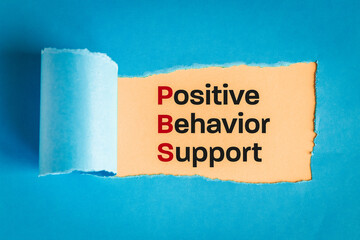 Positive behavior support symbol. text appearing behind torn paper, blue background, concept words...