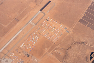 Victorville, California, USA:  Aerial view of the Southern California Logistics Airport - SCLA  boneyard where jets are parked while they are getting ready to be scrapped - obrazy, fototapety, plakaty