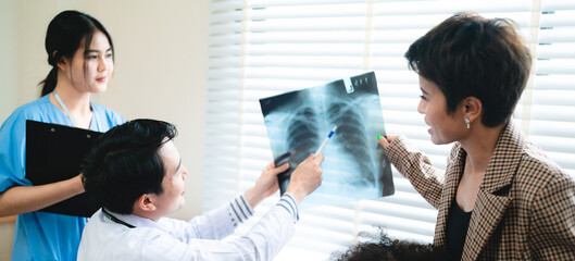 aging society and health insurance concept, professional radiologist or specialist doctor showing...