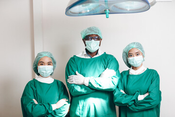Fototapeta na wymiar concentrated professional surgeons team during operation process in surgery by stand up through many hour surgeries, tumor cancer. surgical biopsy specimens. healthcare and medical concept.