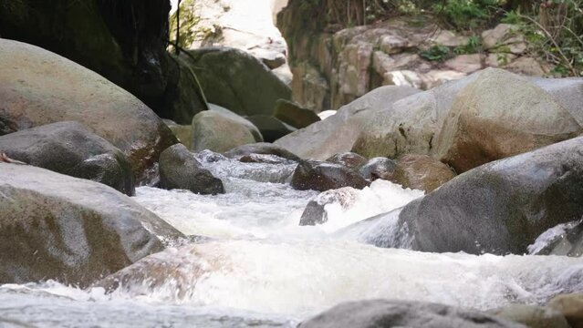 Water Flows Through Rocks in the Pristine Nus River