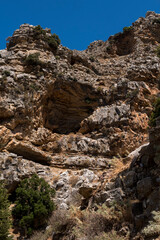 Cave on steep slope of a mountains at Rhodes Island