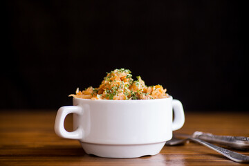 stewed cabbage with carrots and spices in a bowl
