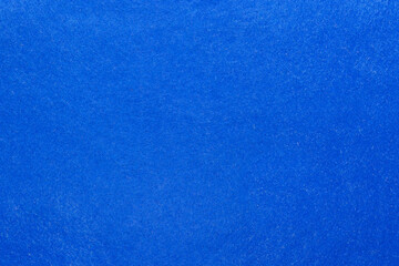Texture of a sheet of dark blue felt for needlework